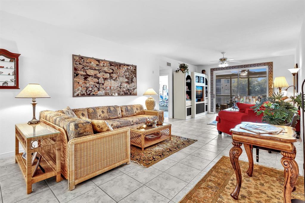 7715 Southampton Terrace, Unit 301 Tamarac, FL 33321 - Photo 20 of 76 a living room with furniture and a couch