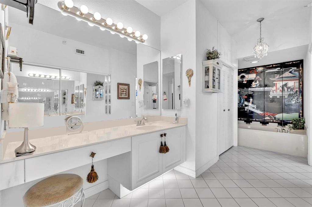 7715 Southampton Terrace, Unit 301 Tamarac, FL 33321 - Photo 30 of 76 a spacious en suite bathroom with a double vanity sink a mirror and shower