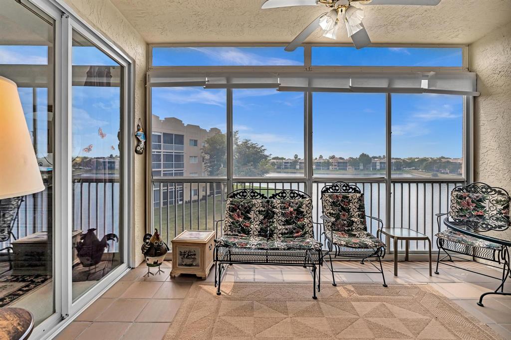 7715 Southampton Terrace, Unit 301 Tamarac, FL 33321 - Photo 37 of 76 a living room with furniture and a large window