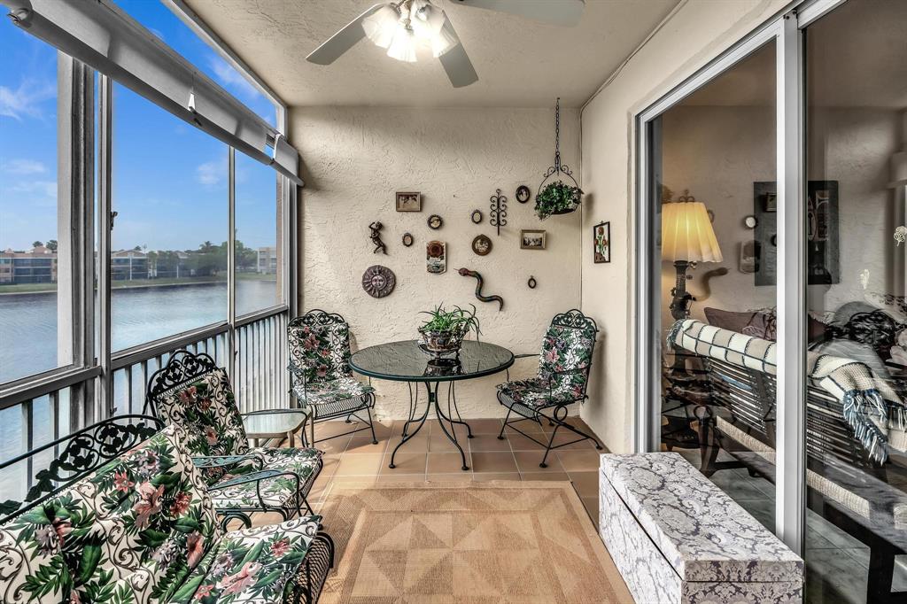 7715 Southampton Terrace, Unit 301 Tamarac, FL 33321 - Photo 39 of 76 a living room with furniture and a large window