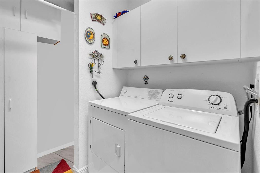 7715 Southampton Terrace, Unit 301 Tamarac, FL 33321 - Photo 43 of 76 a utility room with dryer and washer