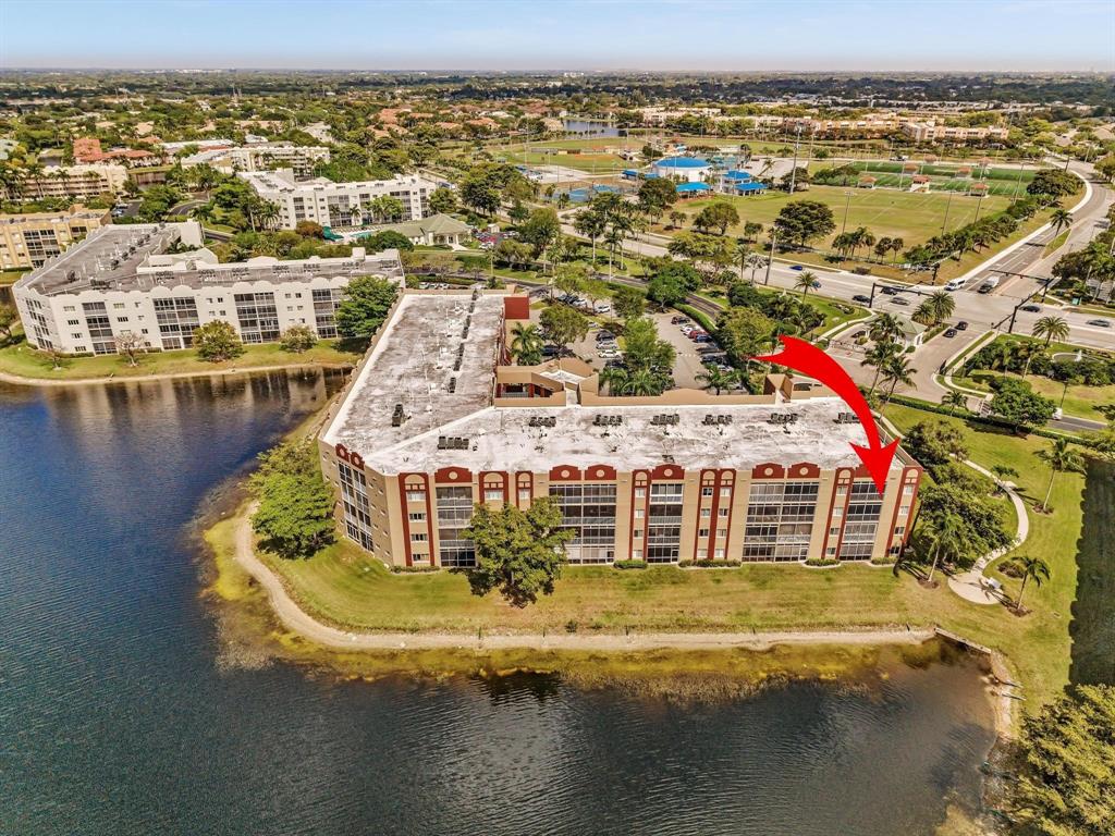 7715 Southampton Terrace, Unit 301 Tamarac, FL 33321 - Photo 54 of 76 a view of a lake with a city