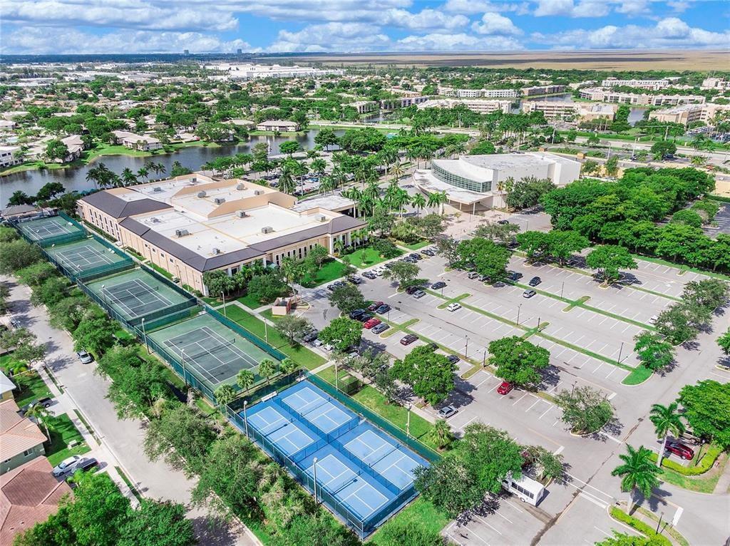 7715 Southampton Terrace, Unit 301 Tamarac, FL 33321 - Photo 74 of 76 an aerial view of a city with lots of residential buildings and mountain view in back