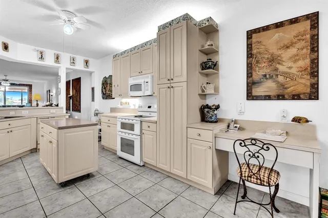 a kitchen with cabinets appliances and a counter top space