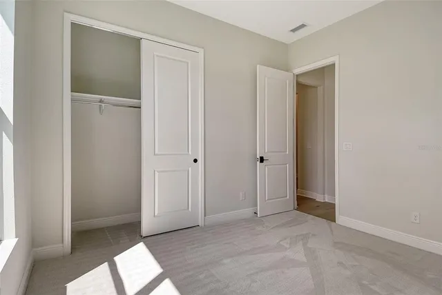 a view of an empty room and window