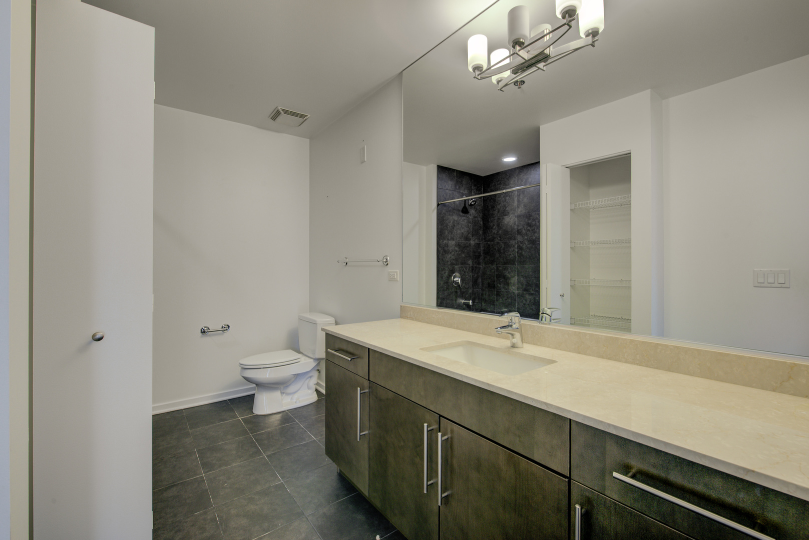 123 South Green Street, Unit 803B Chicago, IL 60607 - Photo 23 of 32 a bathroom with a sink a toilet and mirror