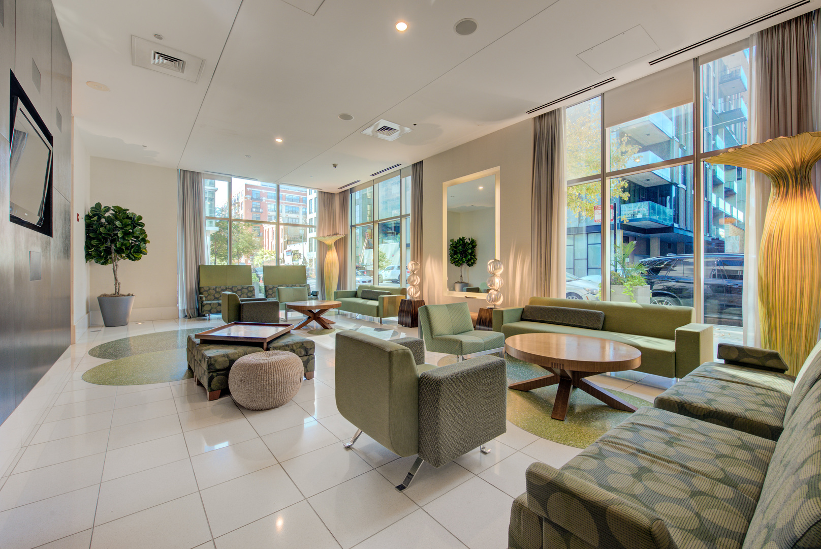 123 South Green Street, Unit 803B Chicago, IL 60607 - Photo 26 of 32 a living room with furniture a rug and a window