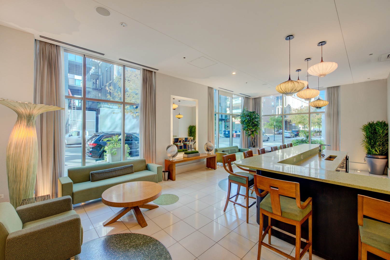 123 South Green Street, Unit 803B Chicago, IL 60607 - Photo 27 of 32 a living room with furniture a table and a large window