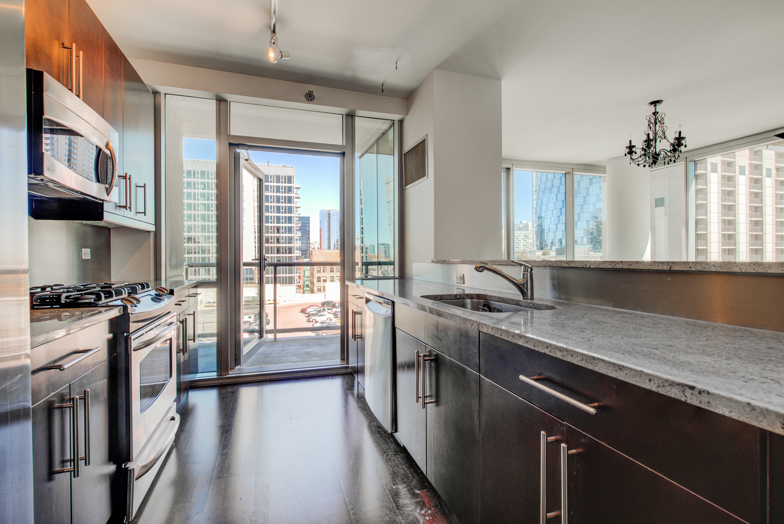 123 South Green Street, Unit 803B Chicago, IL 60607 - Photo 7 of 32 a kitchen with stainless steel appliances granite countertop a sink stove and cabinets