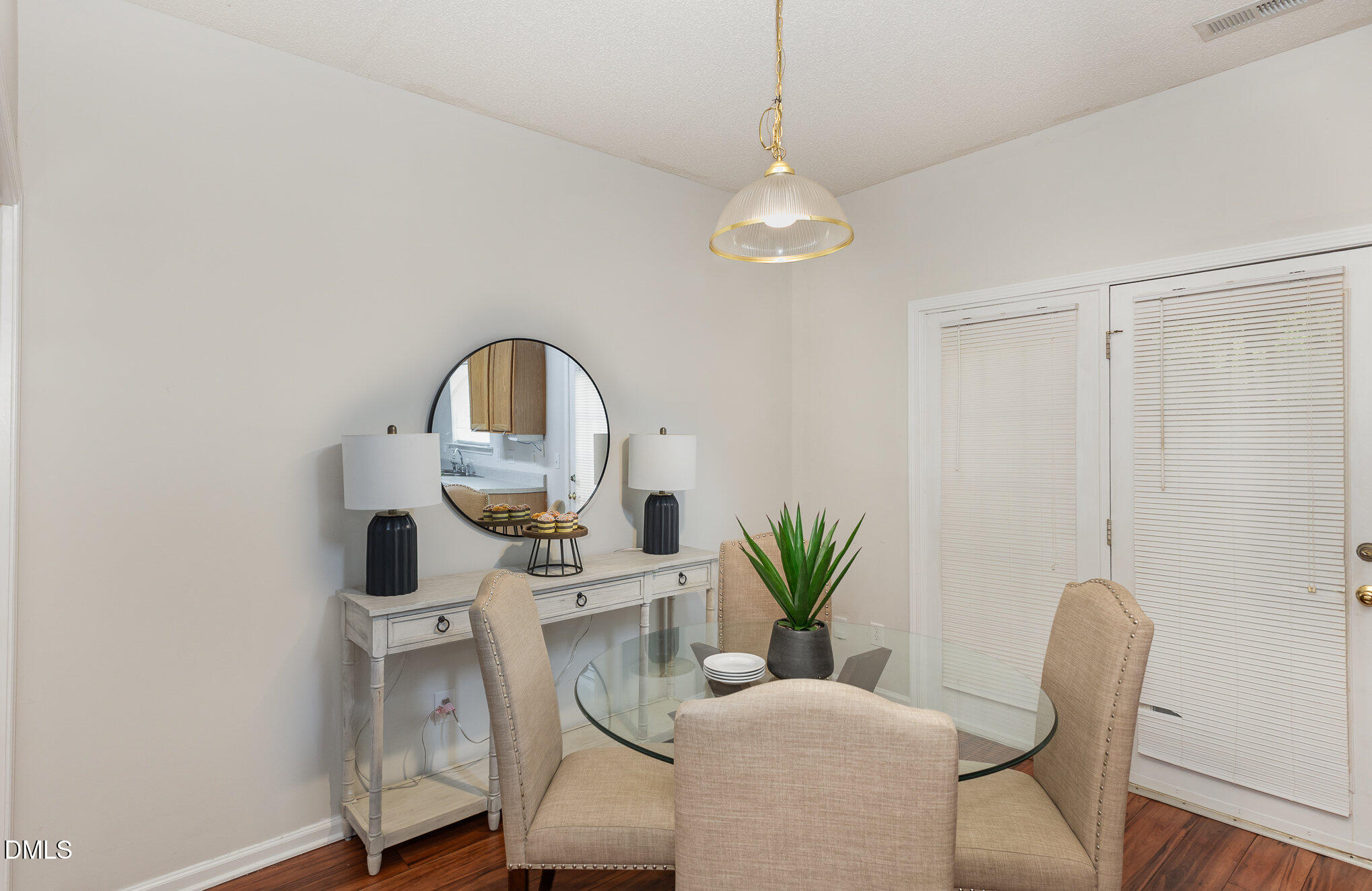 10947 Pendragon Place Raleigh, NC 27614 - Photo 7 of 21 a view of a dining room with furniture and wooden floor