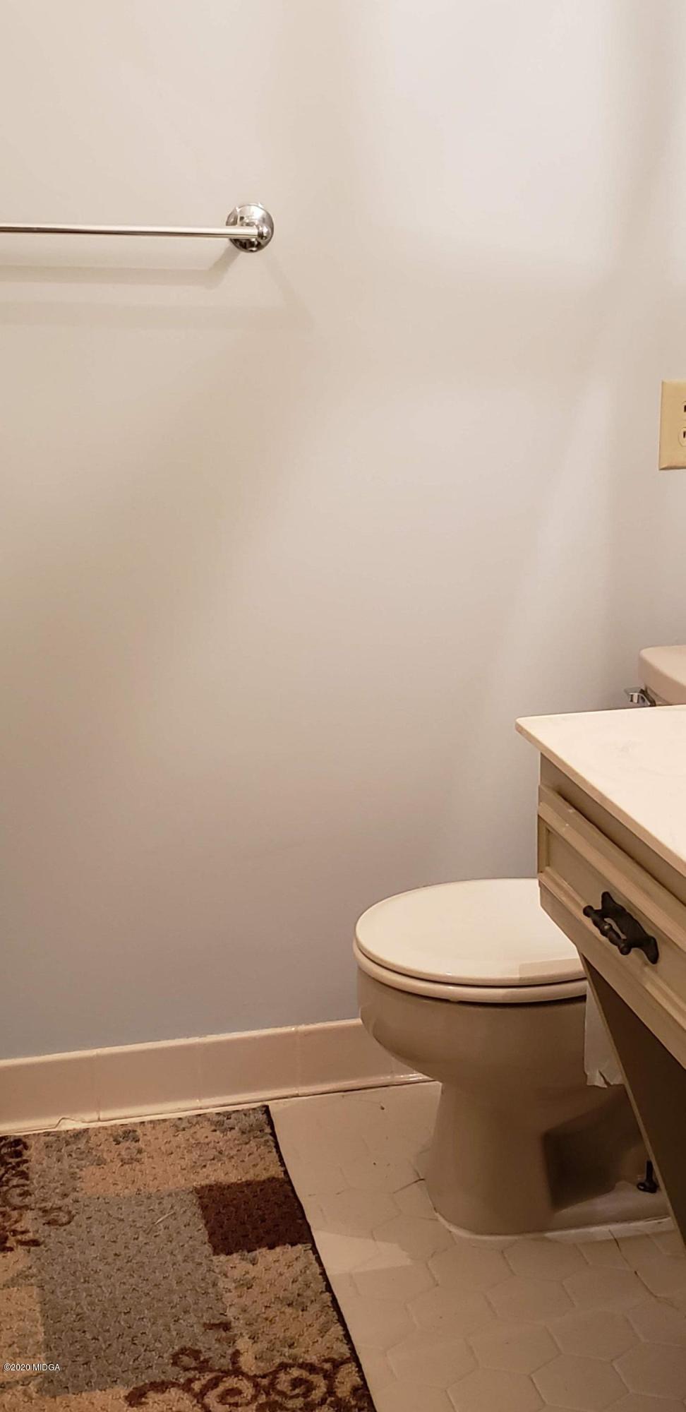 291 Morton Road Gray, GA 31032 - Photo 13 of 33 a white toilet sitting next to a white sink