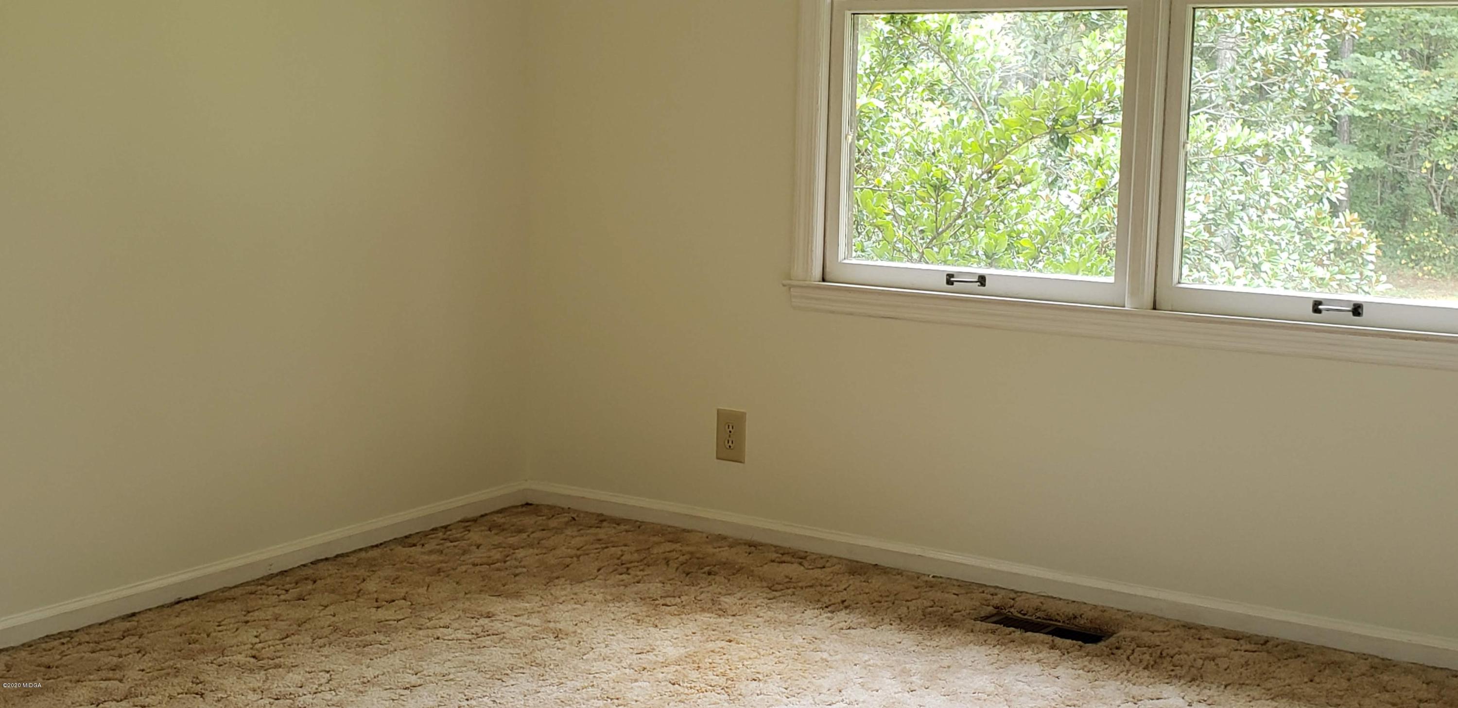 291 Morton Road Gray, GA 31032 - Photo 16 of 33 an empty room with a window