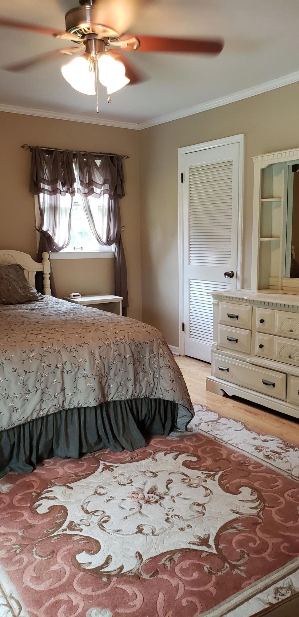 291 Morton Road Gray, GA 31032 - Photo 17 of 33 a bedroom with a large bed and a window
