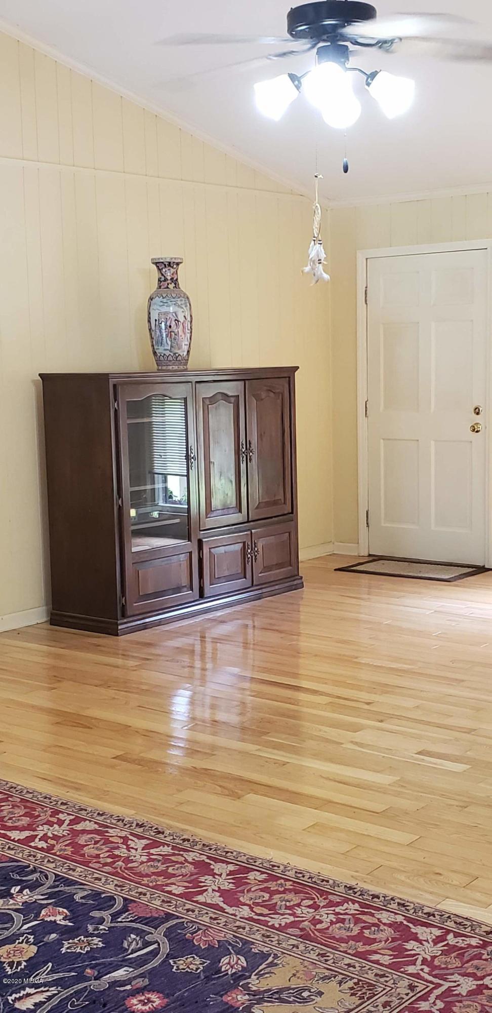 291 Morton Road Gray, GA 31032 - Photo 3 of 33 a view of room with window and wooden floor