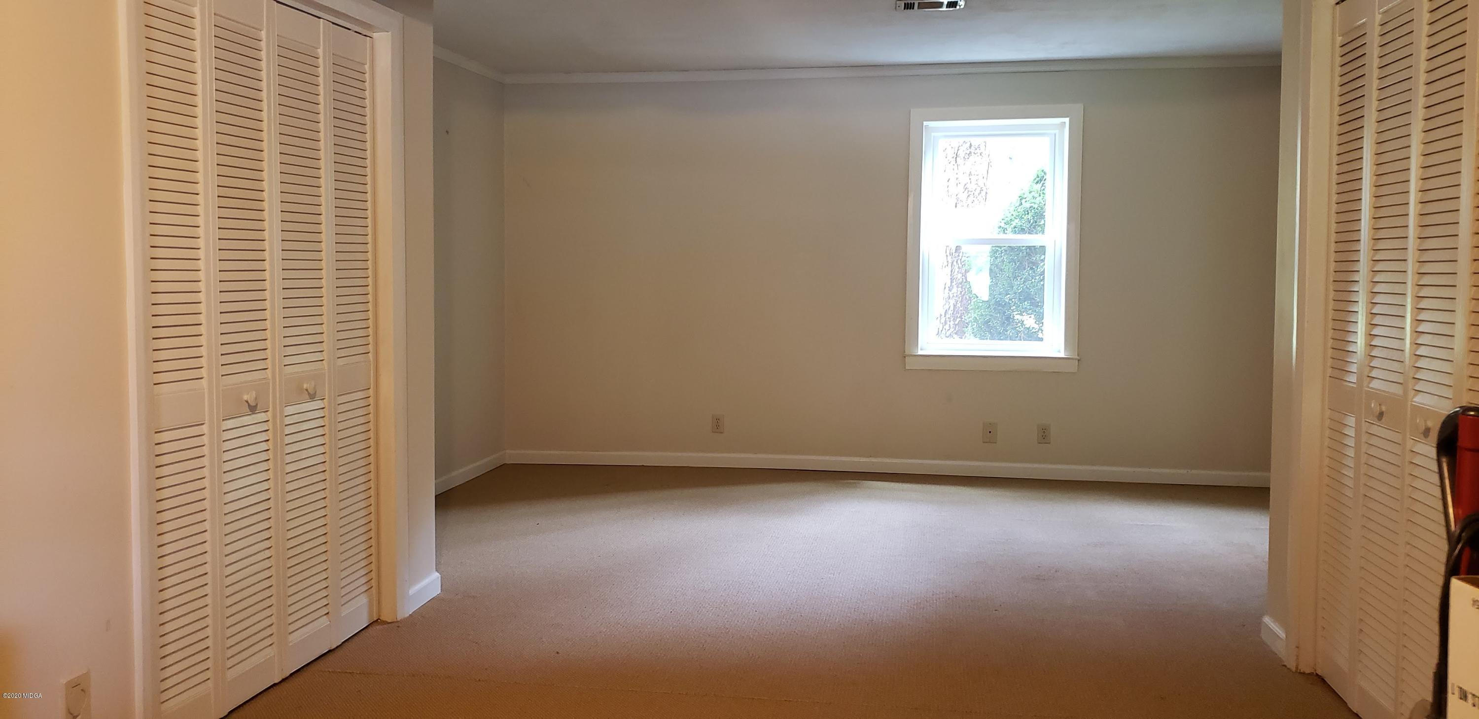 291 Morton Road Gray, GA 31032 - Photo 22 of 33 an empty room with a window