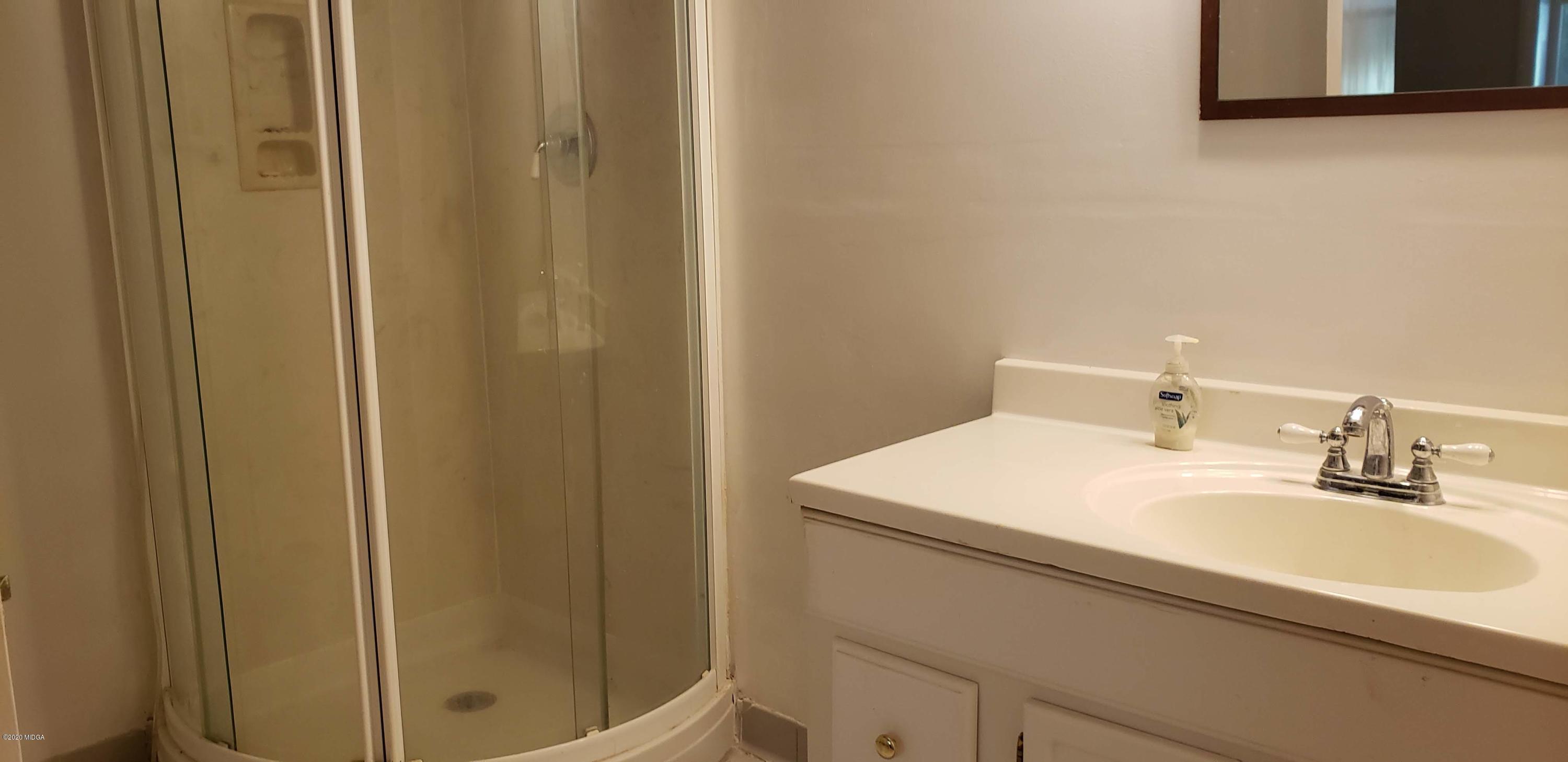 291 Morton Road Gray, GA 31032 - Photo 24 of 33 a bathroom with a sink and a mirror