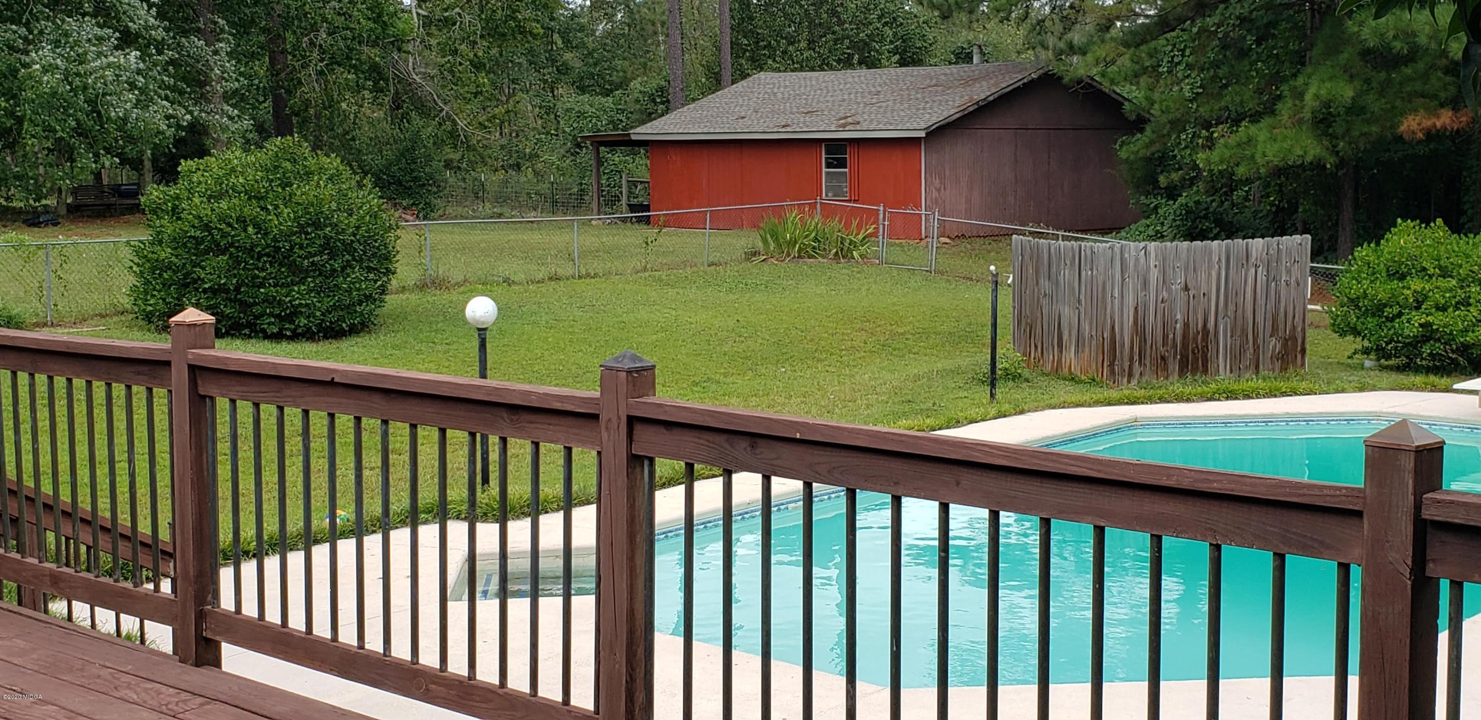 291 Morton Road Gray, GA 31032 - Photo 27 of 33 a view of a wooden fence and a yard