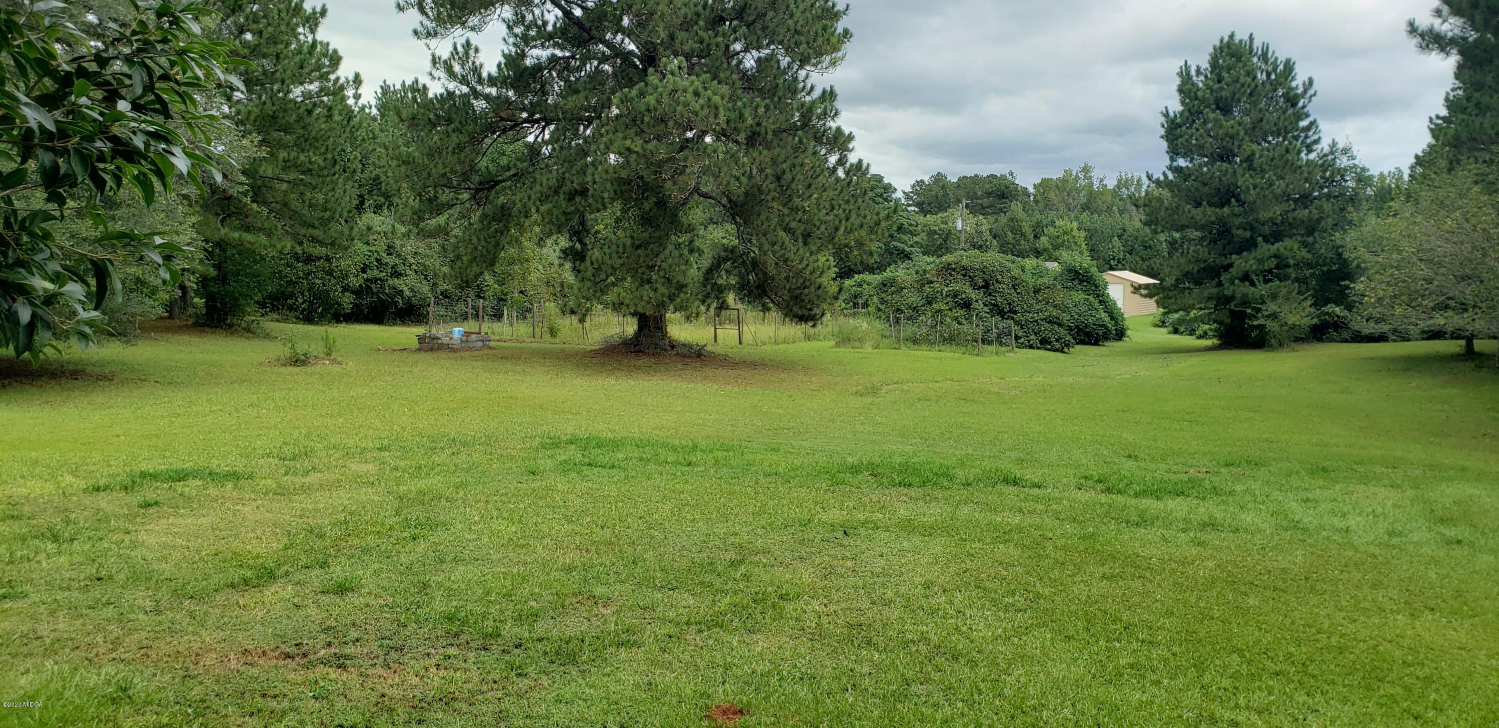 291 Morton Road Gray, GA 31032 - Photo 30 of 33 a view of field with trees in the background