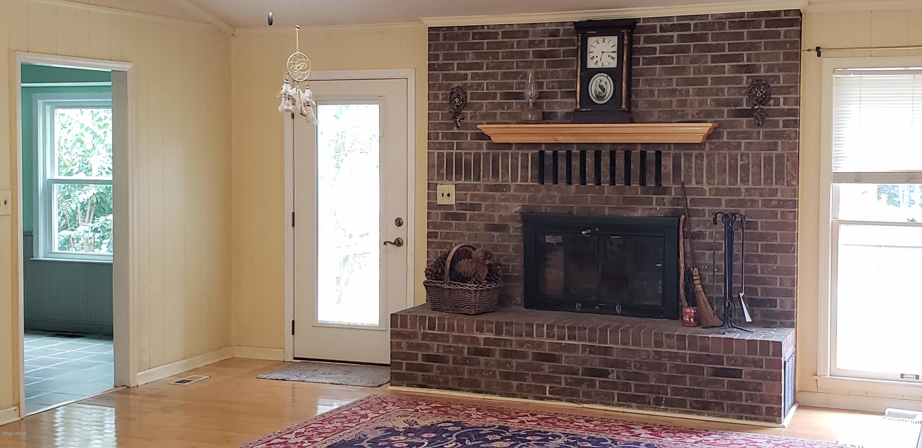 291 Morton Road Gray, GA 31032 - Photo 4 of 33 a living room with fireplace
