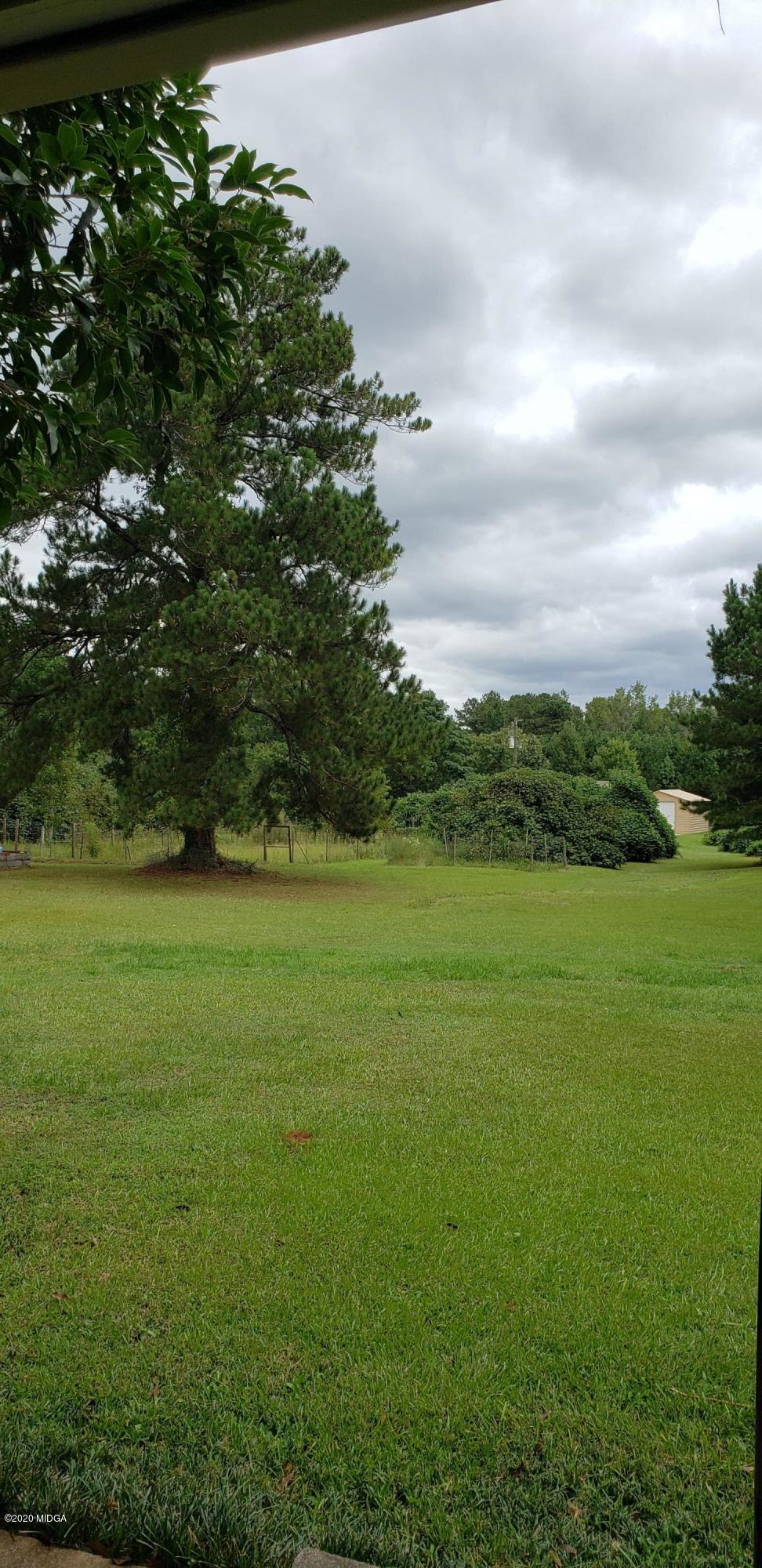 291 Morton Road Gray, GA 31032 - Photo 32 of 33 a view of a field with an trees