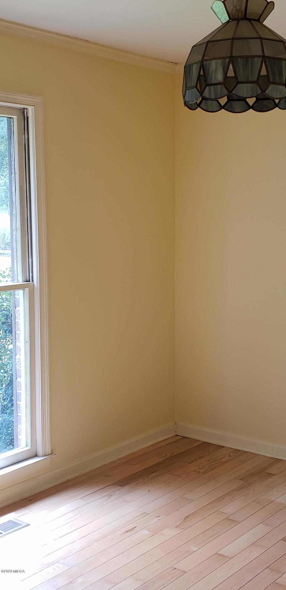 291 Morton Road Gray, GA 31032 - Photo 10 of 33 a view of a small space with wooden floor and a window