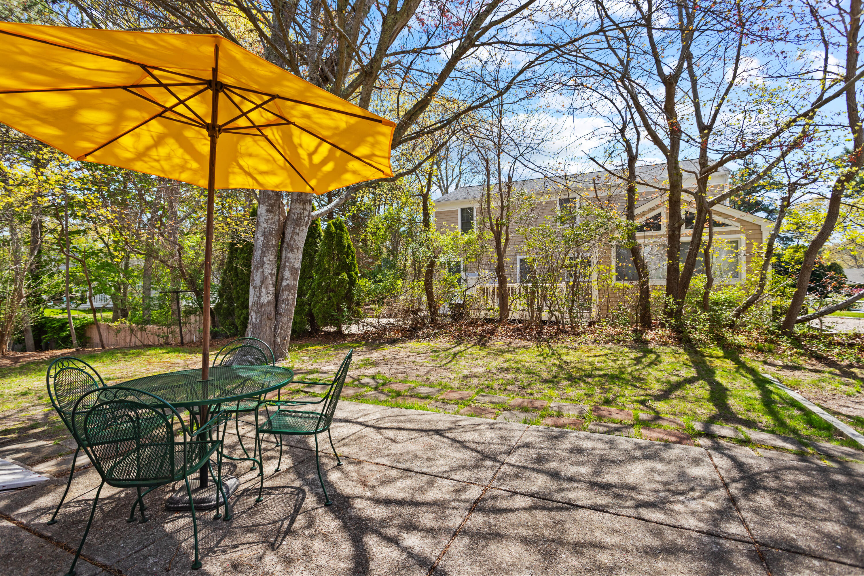 14 Greenwood Road Mashpee, MA 02649 - Photo 1 of 25 a view of a chairs and table in the backyard
