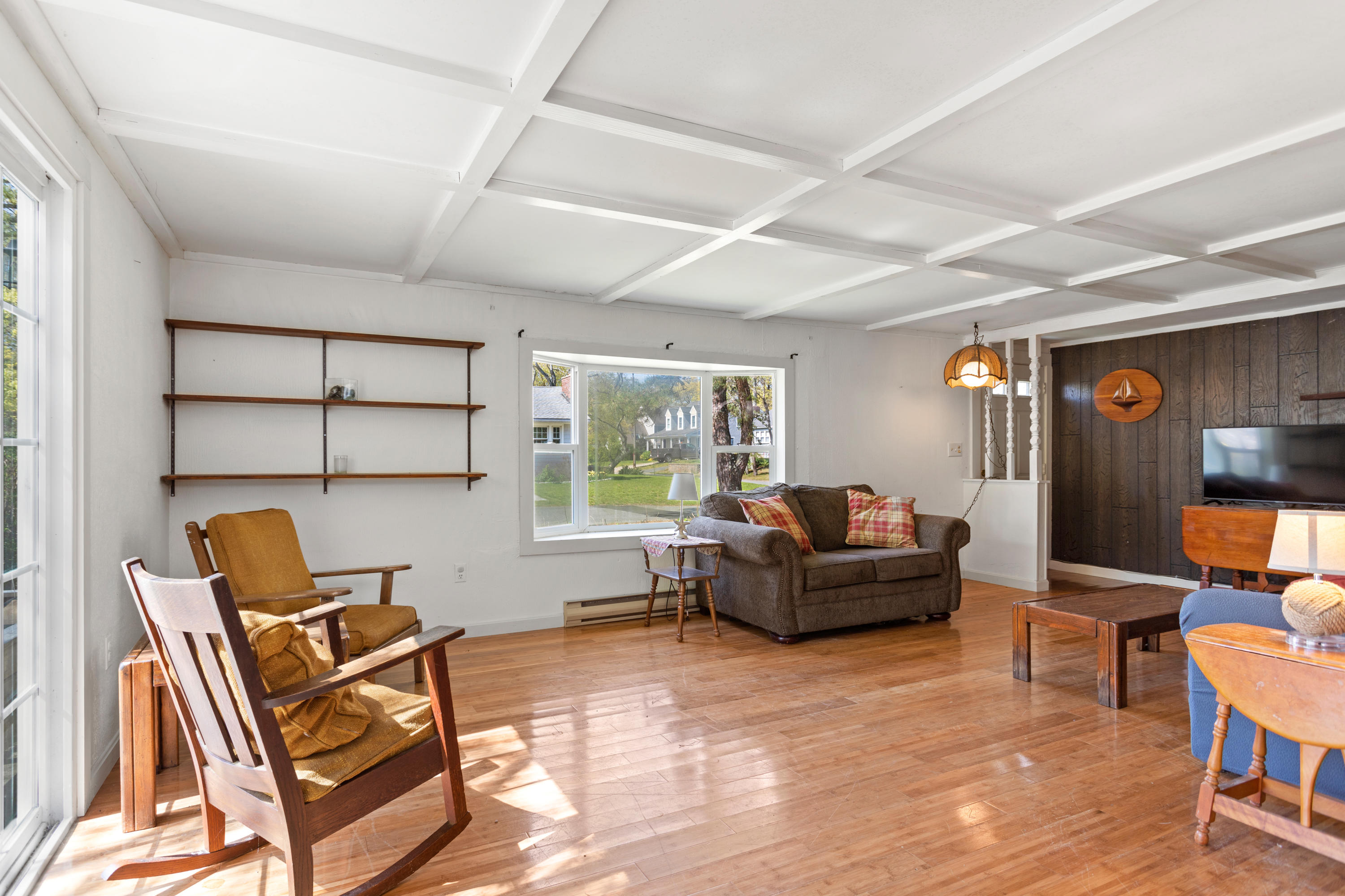 14 Greenwood Road Mashpee, MA 02649 - Photo 21 of 25 a living room with furniture a flat screen tv and a large window