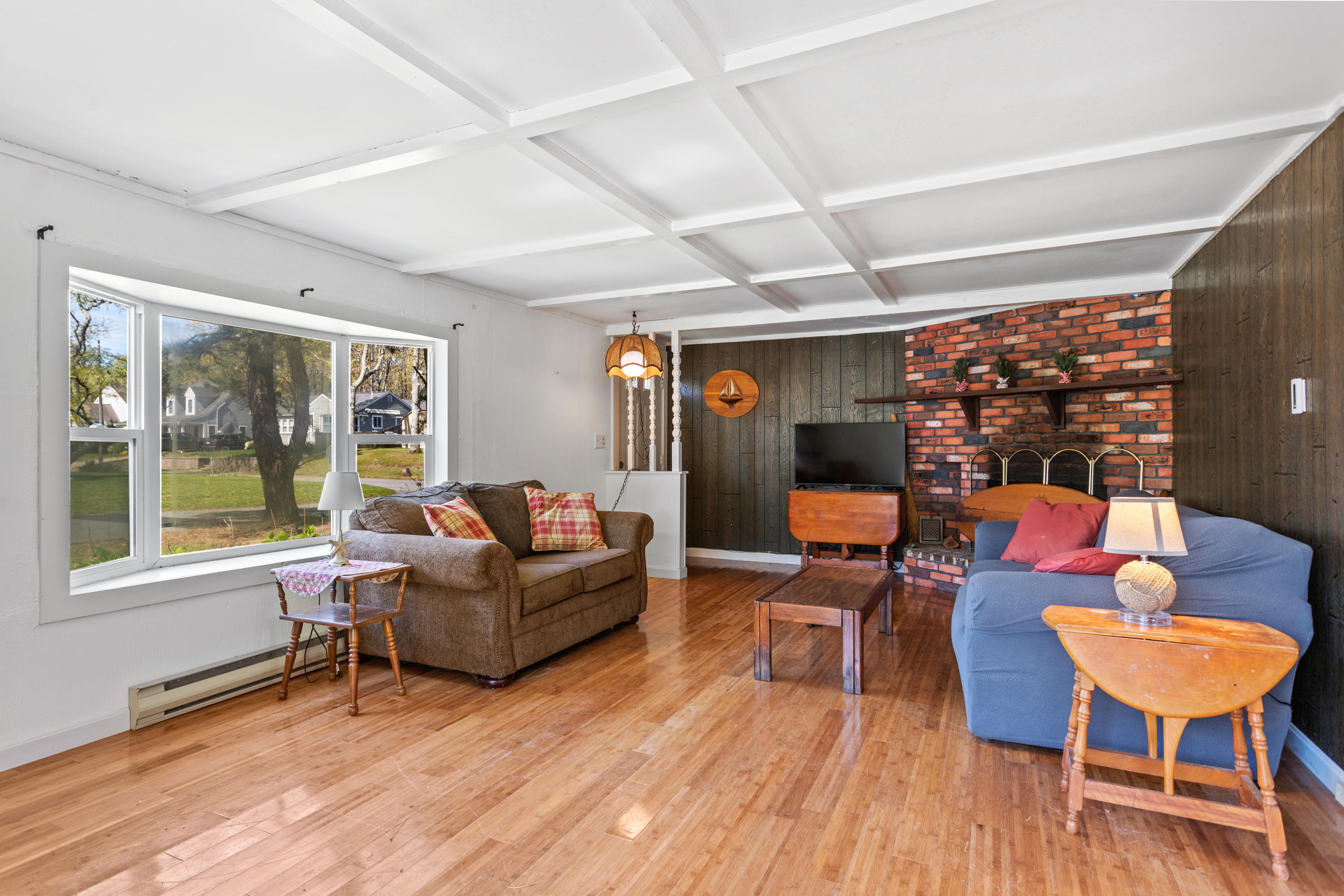 14 Greenwood Road Mashpee, MA 02649 - Photo 22 of 25 a living room with furniture and a wooden floor
