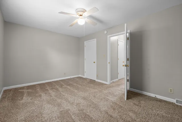 a view of backyard with deck and garden
