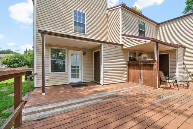 an aerial view of a house with a lake view