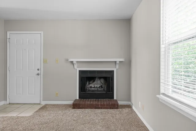 a living room with a fireplace