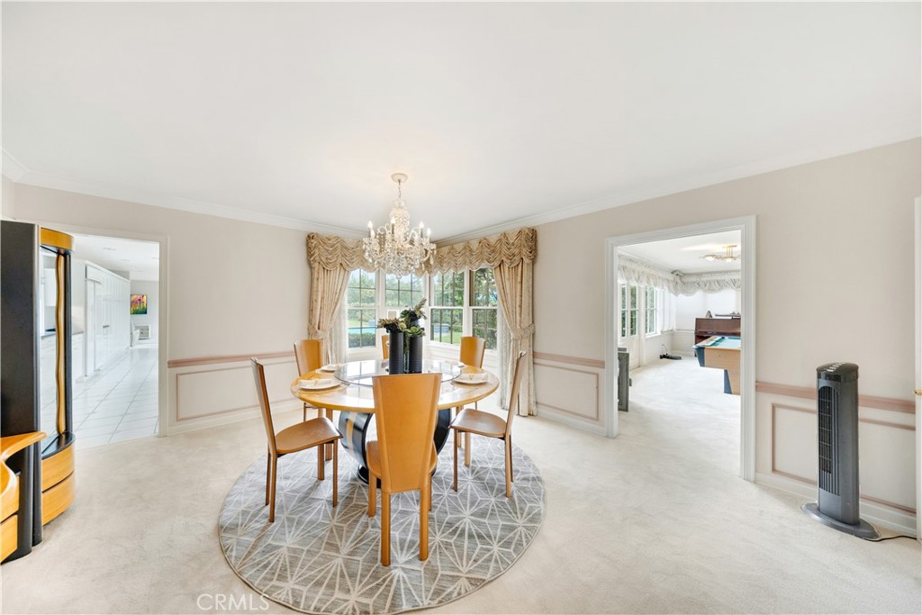 2835 Devonport Road San Marino, CA 91108 - Photo 12 of 54 a view of a dining room with furniture and a chandelier