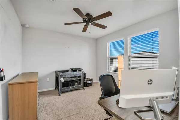 a work room with furniture and windows