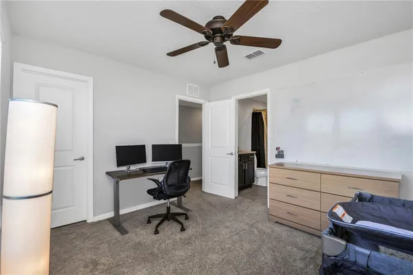 a view of workspace with wooden floor windows