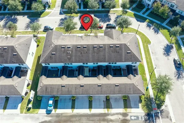 an aerial view of a house with a swimming pool