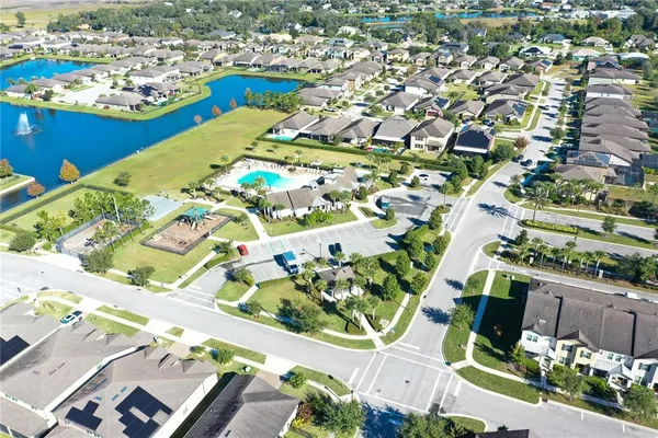 an aerial view of residential houses with outdoor space