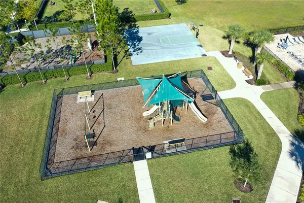an aerial view of a house with a yard