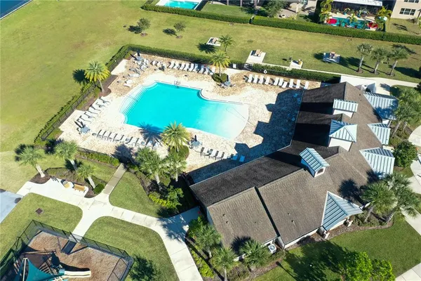 a view of a swimming pool with a yard