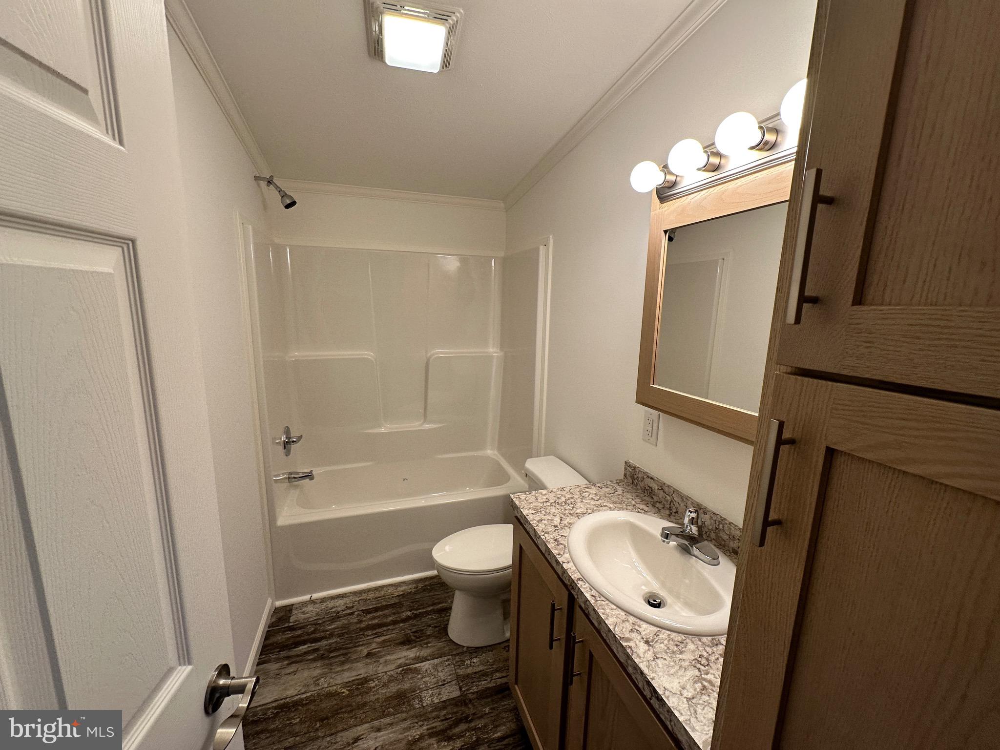 13 Evergreen Alley Palmyra, PA 17078 - Photo 19 of 26 a bathroom with a sink a toilet and shower a mirror