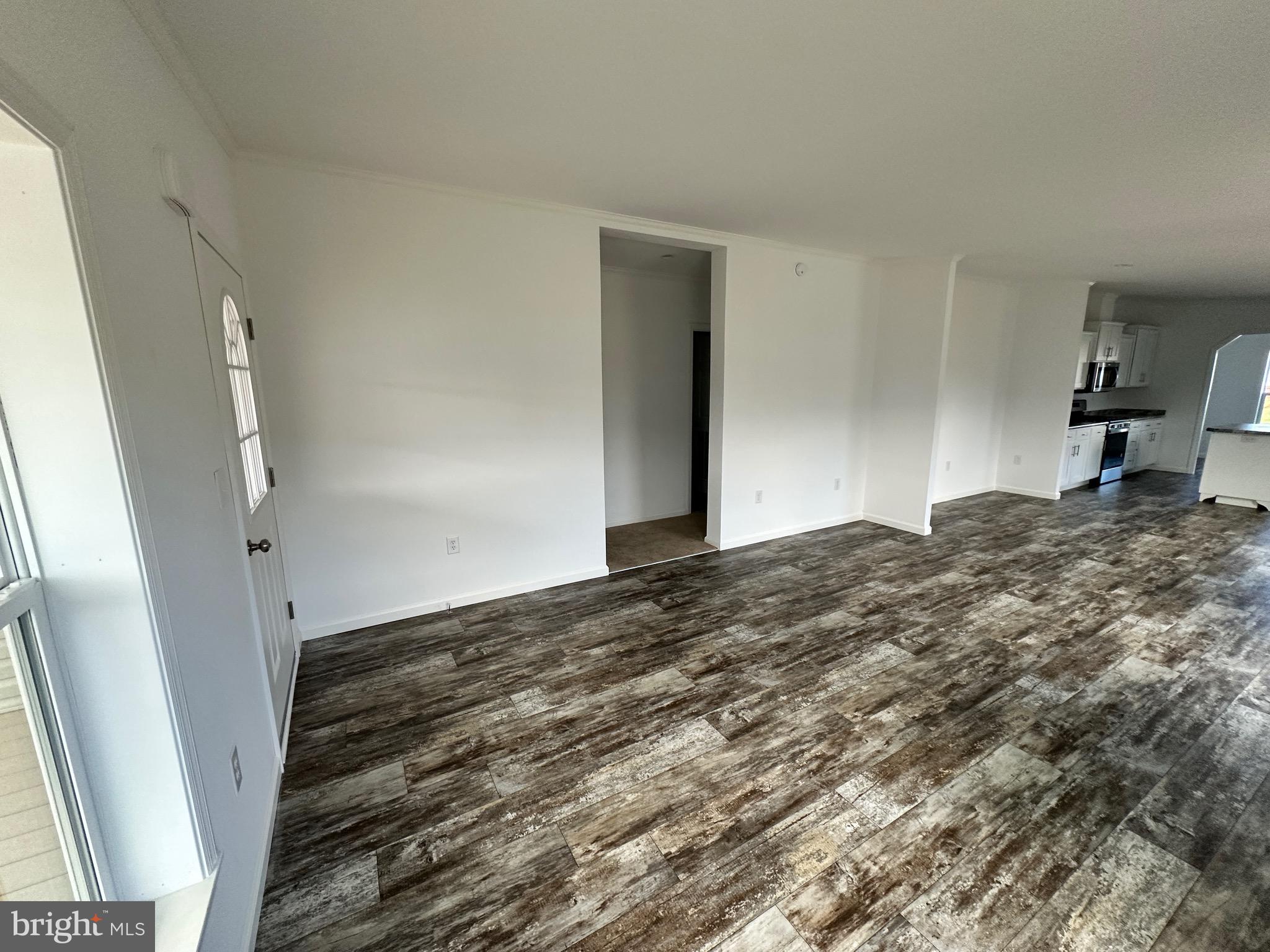 13 Evergreen Alley Palmyra, PA 17078 - Photo 7 of 26 a view of a livingroom with wooden floor and stairs