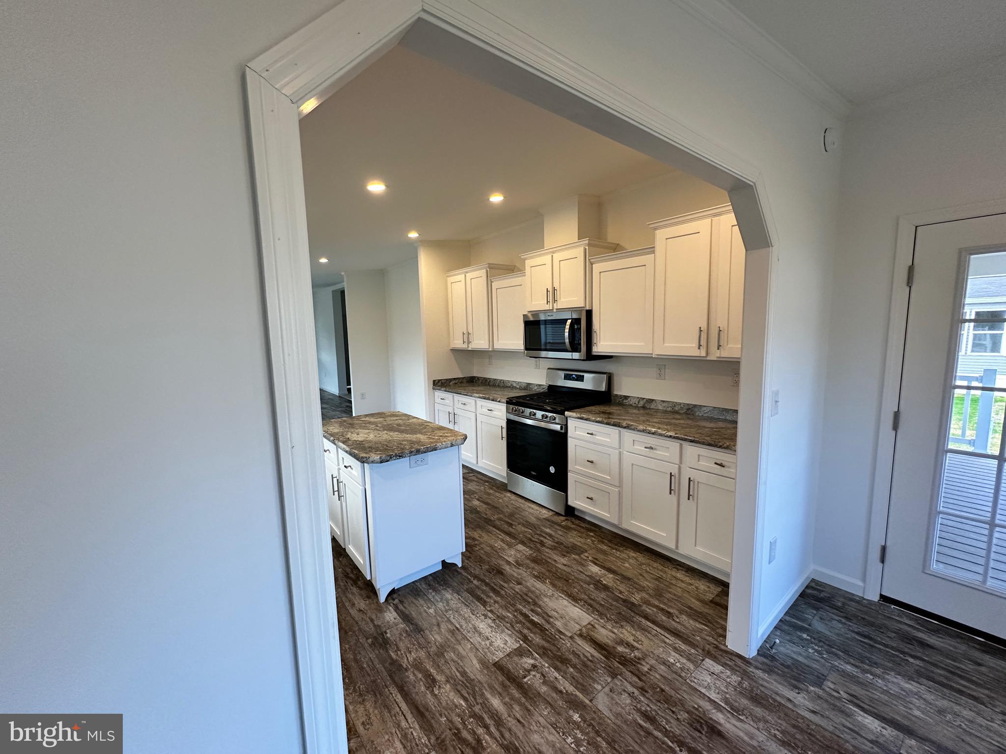 13 Evergreen Alley Palmyra, PA 17078 - Photo 9 of 26 a kitchen with stainless steel appliances granite countertop a stove a sink and a refrigerator