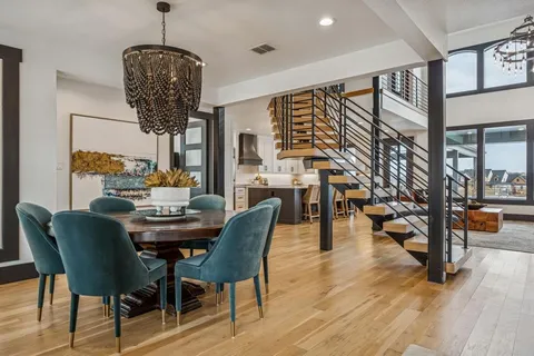 a view of a dining room with furniture window and wooden floor