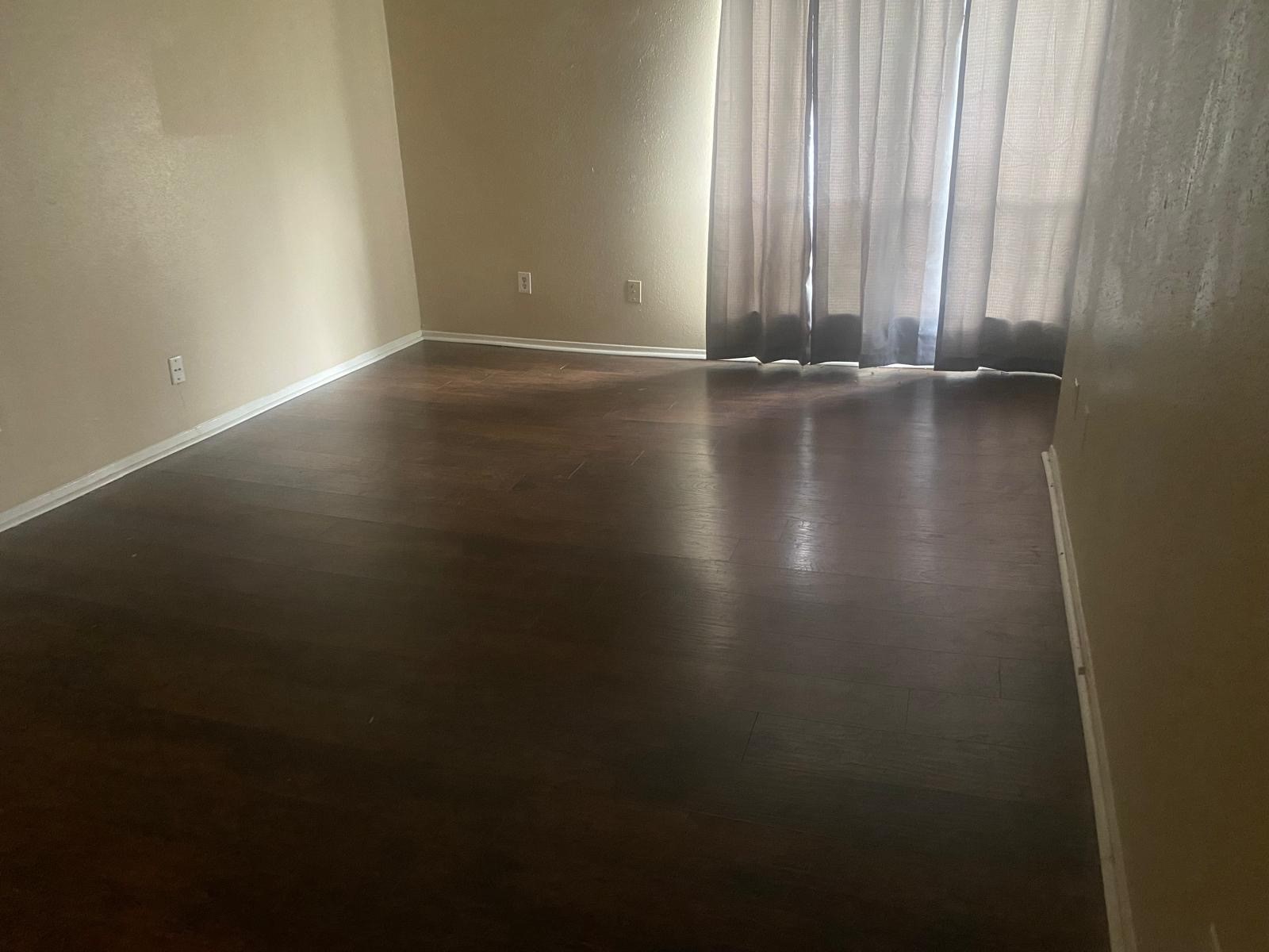 9546 Windswept Lane, Unit 9546 Houston, TX 77063 - Photo 6 of 12 a view of room with window and hardwood