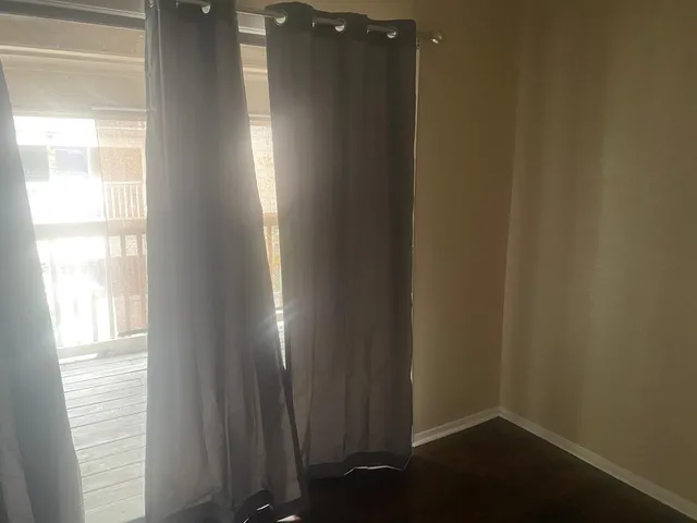 a white toilet sitting next to a bath tub