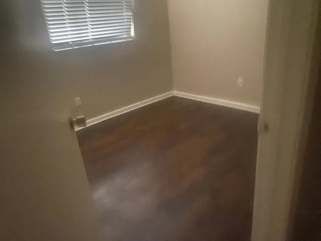 a kitchen with a refrigerator and cabinets