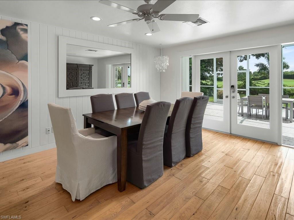 436 Golfview Drive Naples, FL 34110 - Photo 14 of 44 a view of a livingroom with furniture and wooden floor