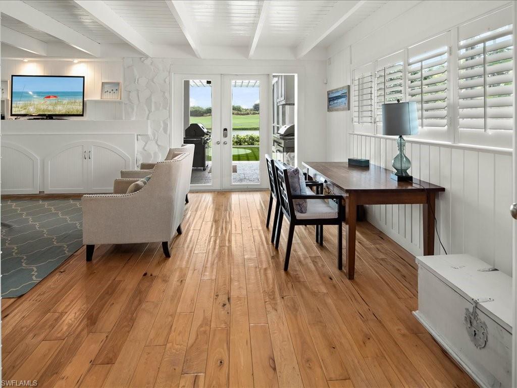 436 Golfview Drive Naples, FL 34110 - Photo 20 of 44 a living room with furniture and a wooden floor