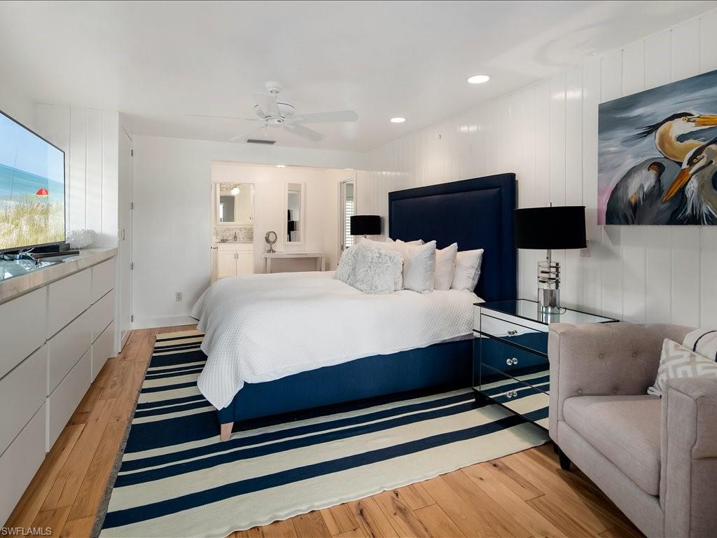 436 Golfview Drive Naples, FL 34110 - Photo 21 of 44 a bedroom with a bed and flat screen tv