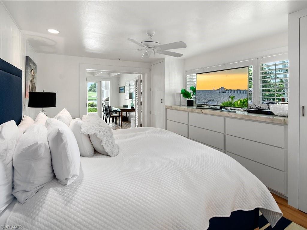 436 Golfview Drive Naples, FL 34110 - Photo 22 of 44 a bedroom with a bed and a flat screen tv