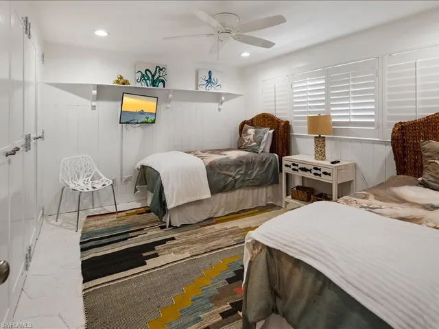 a bedroom with bed and a window